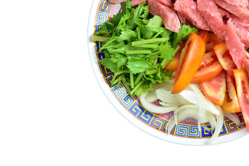 Colorful vegetables on the plate on a white background .