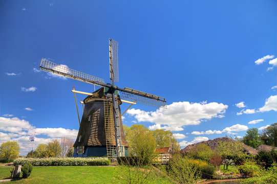 Dutch windmill the 'Riekermolen' near the Amstel park in Amsterdam, the Netherlands. hdr