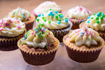 tasty colorful cupcakes with butter cream