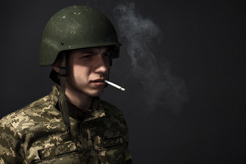 Portrait. A soldier with a cigarette in his mouth