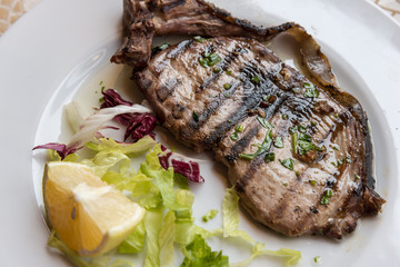 Grilled spadefish - traditional Calabrian dish.
