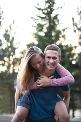 Fototapeta premium Cheerful young hipster couple in love on a sunny day
