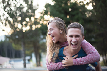 Fototapeta premium Cheerful young hipster couple in love on a sunny day
