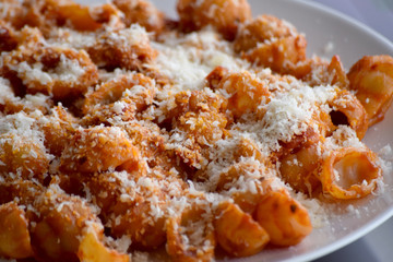 gnocchi pasta with tomato and grated cheese