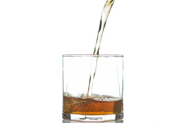Whiskey being poured into a glass