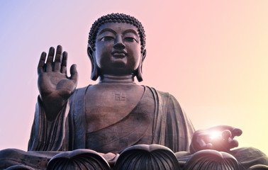 Buddha statue at Po Lin, Hong Kong. Bright light from hand.