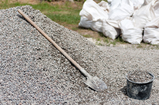 Shovel On A Pile Of Gravel Filled Bucket