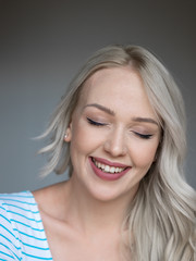 Naklejka premium portrait of attractive caucasian smiling woman blond