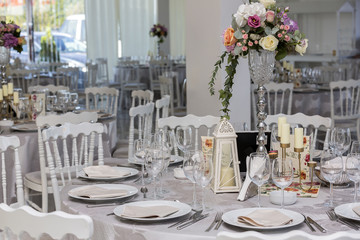 Wedding table arrangements with glases and plates