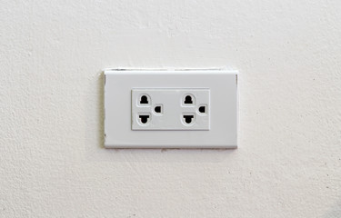 Light socket on white wall