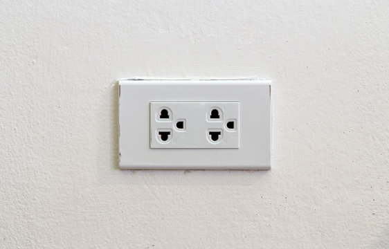 Light socket on white wall