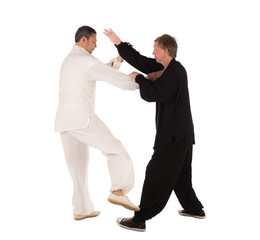 Two karate fighters. Training fight.