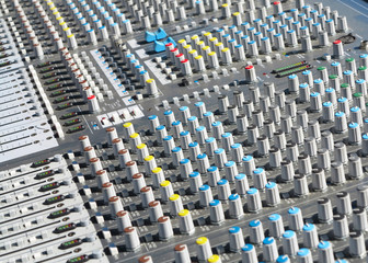 Obraz premium Giant audio sound mixer with color buttons and sliders