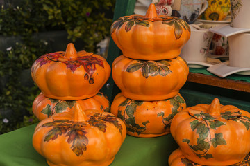 Different types of clay pumpkins on different color and forms