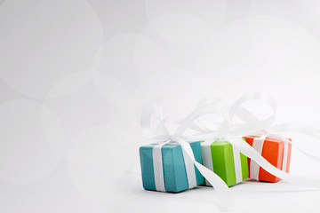 Gifts for Christmas or a birthday - three colourful packages © shake_pl
