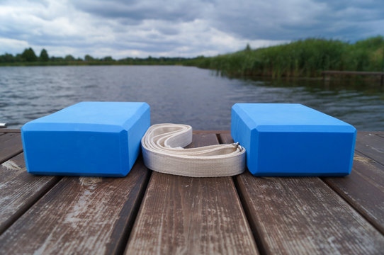 Action In The Wooden Bridge Near Lake. Yoga Equipment.