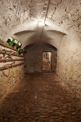 Old, dark basement corridor in ancient house