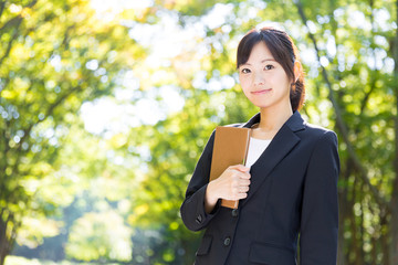 Fototapeta premium asian businesswoman in the park