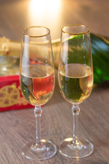 Glasses of champagne with gift box
