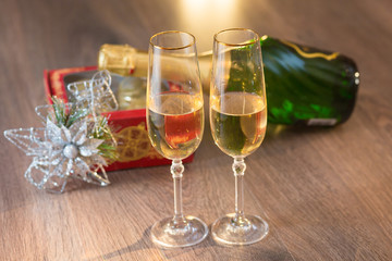 Glasses of champagne with gift box