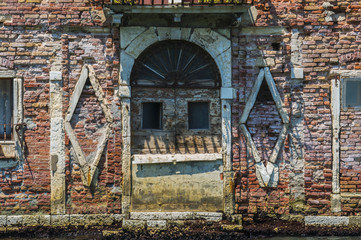 Old disused warehouse in Venice Italy decorated like a Cyberman Robot
