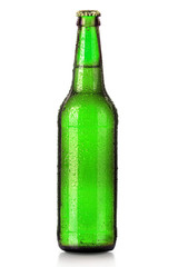 Bottle of beer with drops isolated on white