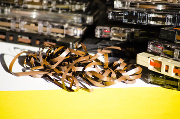 group of old cassette tapes on colored background