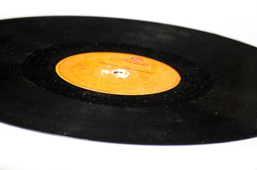 Black vinyl record isolated on colored background