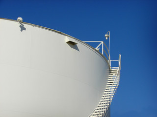 industrial tank with ladder and blue sky