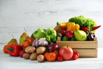 Photo sur Plexiglas Légumes Heap of fresh fruits and vegetables on wooden background