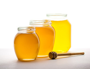 jars of honey on a white background. food, medicine