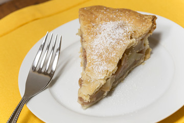 Slice of Apple Pie on a white plate
