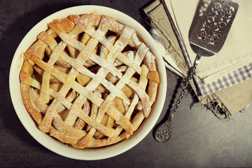 Homemade apple pie on wooden background