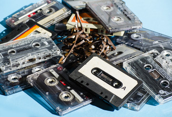 old cassette tapes on colored background - obrazy, fototapety, plakaty