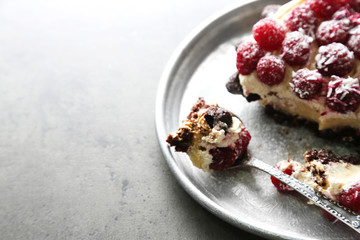 Sweet cake with raspberries on dark background