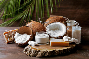 Spa coconut products on dark wooden background