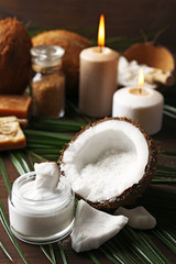 Spa coconut products on dark wooden background