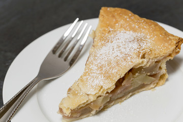 Slice of Apple Pie on a white plate