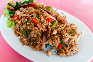 Minced duck spicy salad with herbs.Selective focus