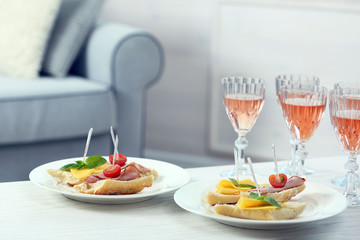 Table at home with food and drinks for friends