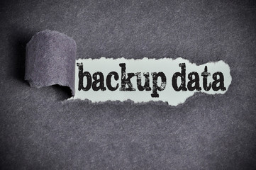 backup data word under torn black sugar paper