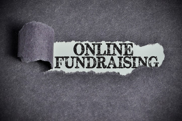 online fundraising word under torn black sugar paper - 94186857