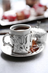 Antique tea-set with Turkish delight on table close-up