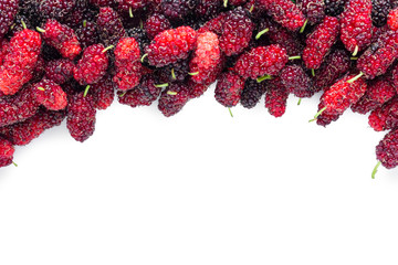 Stack of mulberries  on  white background.