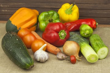 Fresh colorful vegetables on table. Fresh vegetables ready for processing. Kitchen table, ready for cooking vegetable dishes.
