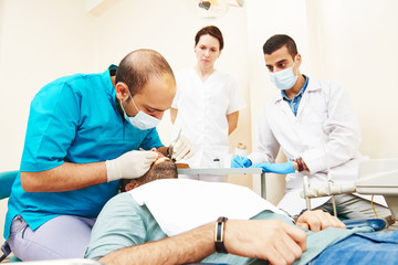Female dentist doctor teaching students