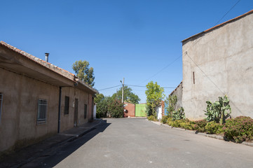 Fototapeta na wymiar Traditional street in a small hamlet in La Mancha, Ciudad Real Province, Spain