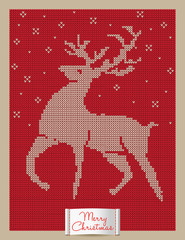 Christmas greeting card with knitted reindeer