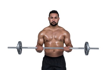 Fototapeta na wymiar Muscular man lifting heavy barbell