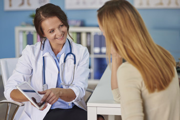 Young woman paying a visit at the doctor